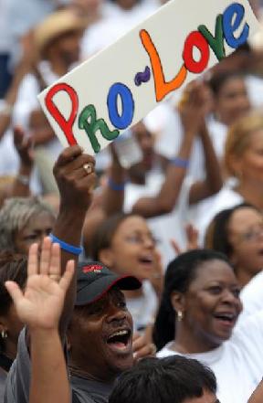 Howard Harris of Ellenwood joins in the rally after the Pro Love March.
