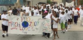 A few hundred people, mostly from the Cathedral at Chapel Hill, participate in the Pro Love March in downtown Atlanta on Saturday.